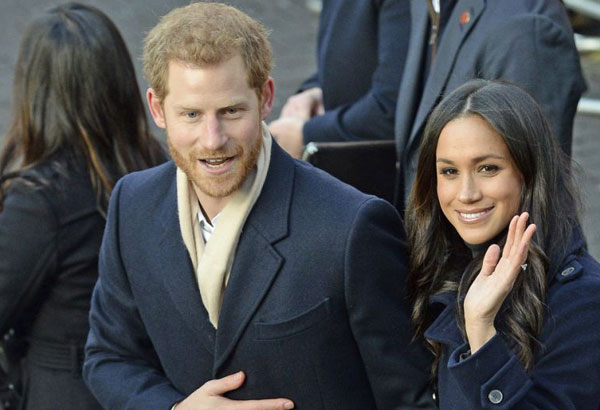 Prince Harry, Meghan Markle greet fans in English city