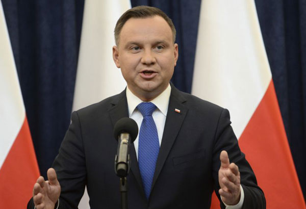Polish president to sign law barring some Holocaust speech
