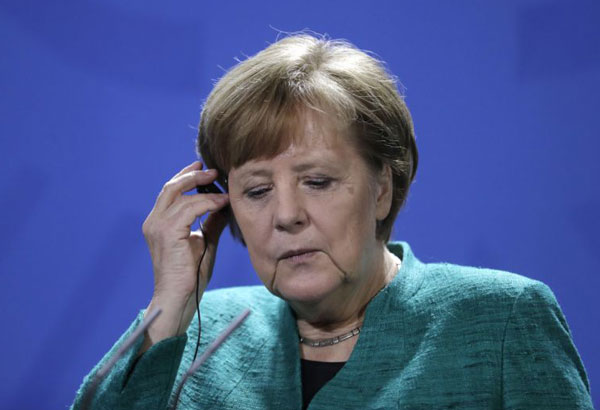 Merkel calls for progress on common EU asylum system