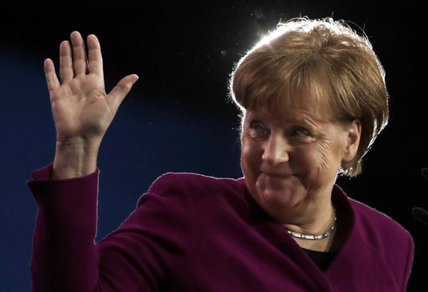 Merkel's party backs coalition deal to form new German gov't