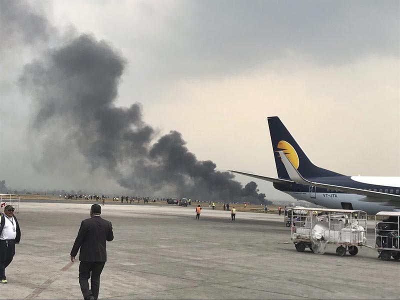 Passenger plane crashes, catches fire at Kathmandu airport