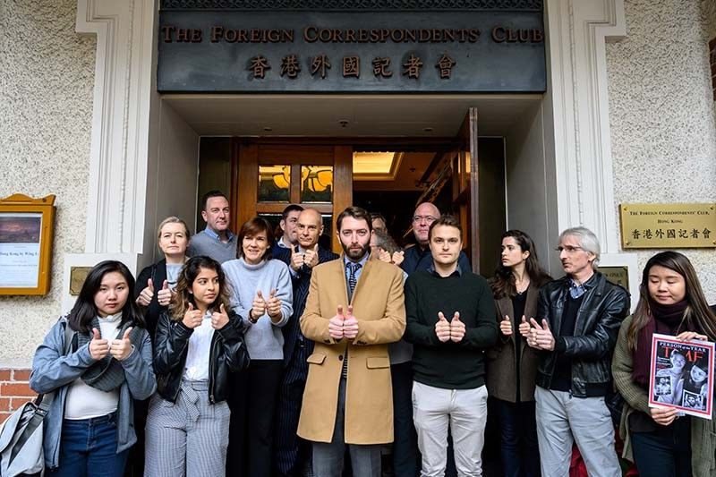 'Thumbs up' pics for Myanmar Reuters reporters as they mark year in jail