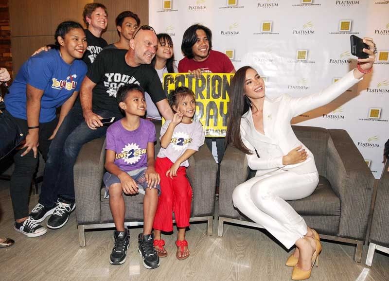 Catriona Gray back in Philippines, welcomed by children