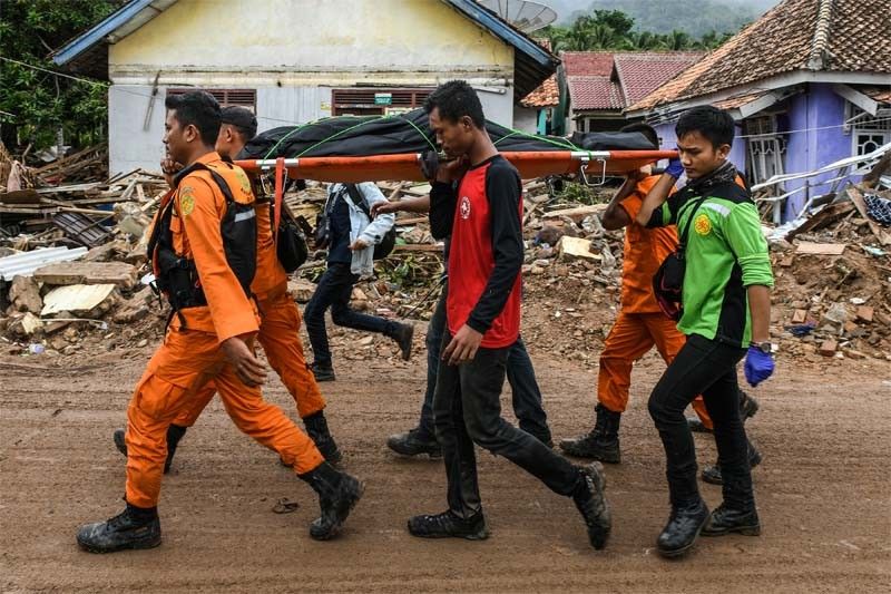 Indonesia rescuers scramble to reach isolated tsunami-struck towns