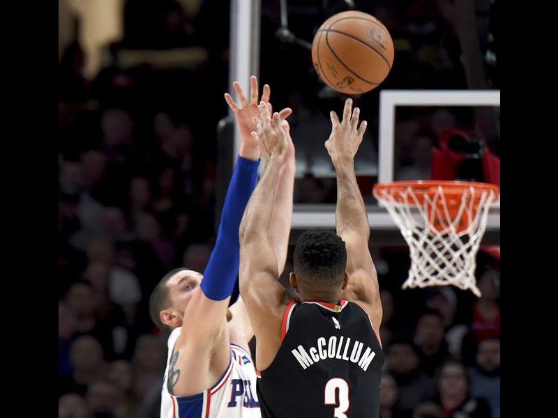 McCollum powers Trail Blazers in routing 76ers