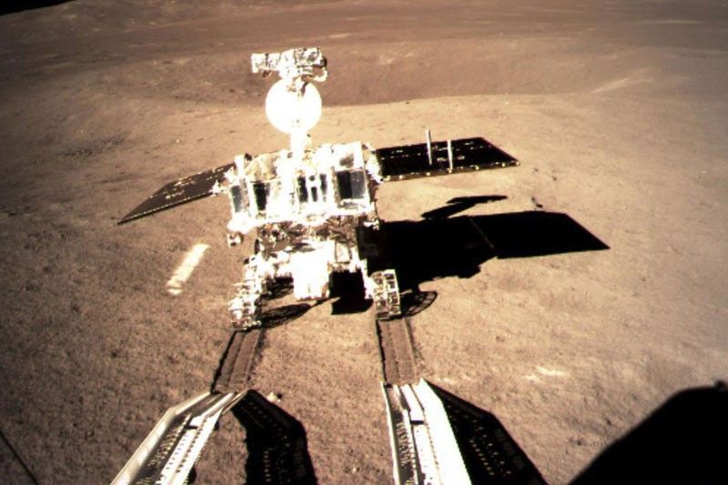 China moon rover powers up devices in far side mission