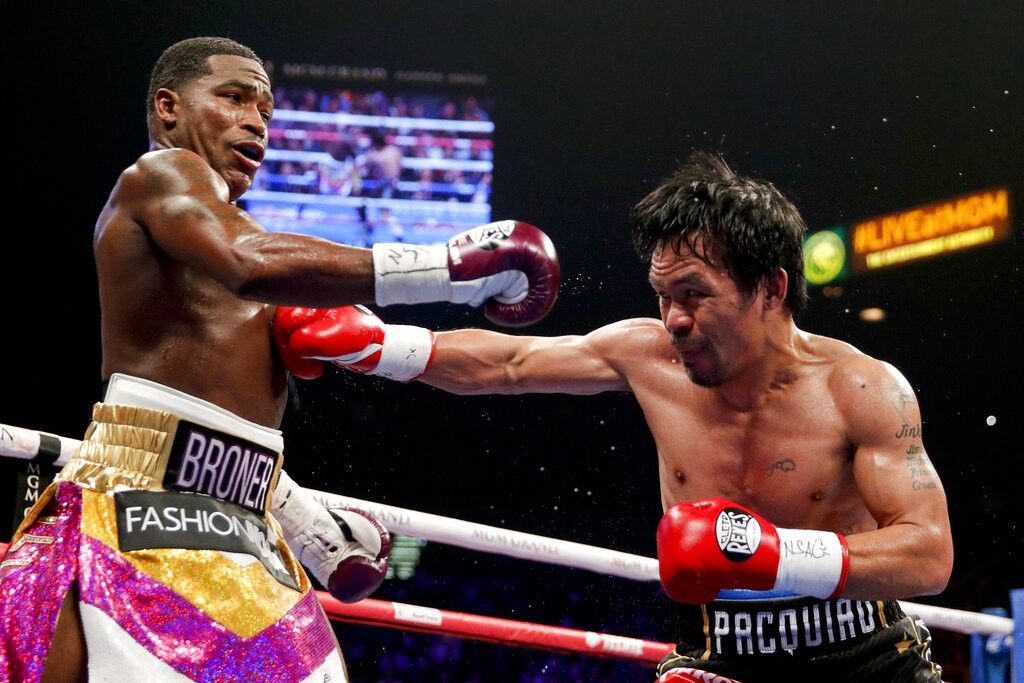 No â��Problemâ�� at 40: Pacquiao blanks Broner to defend title