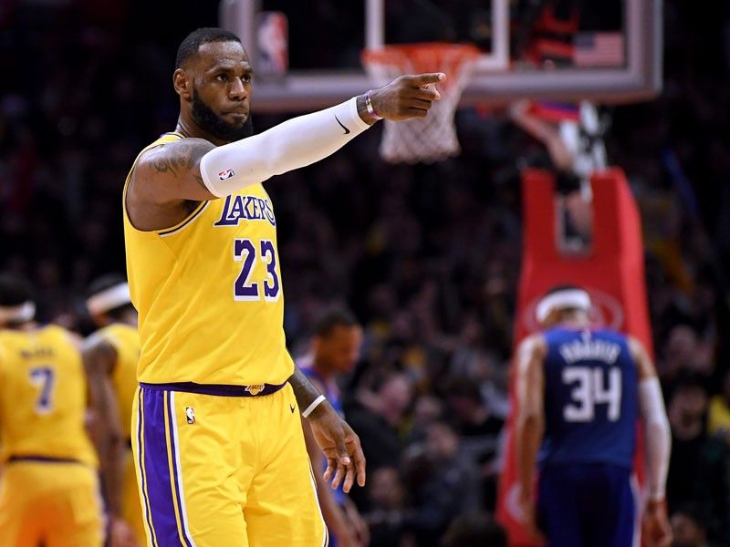 With LeBron back, Lakers outlast Clippers in OT