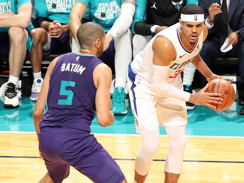 Tobias Harris and Boban Marjanovic of the LA Clippers exchange