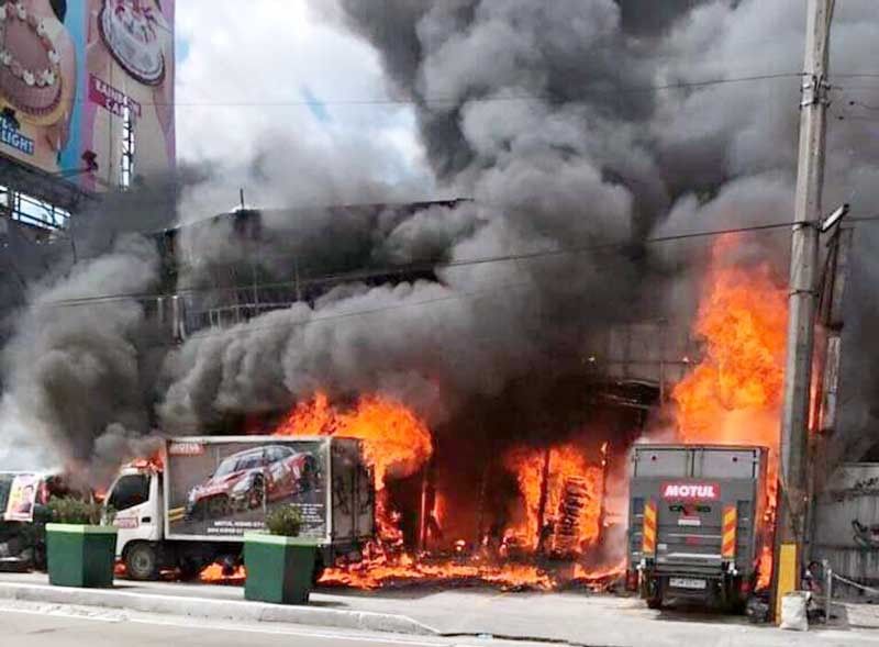 Fire razes high-end auto repair shop