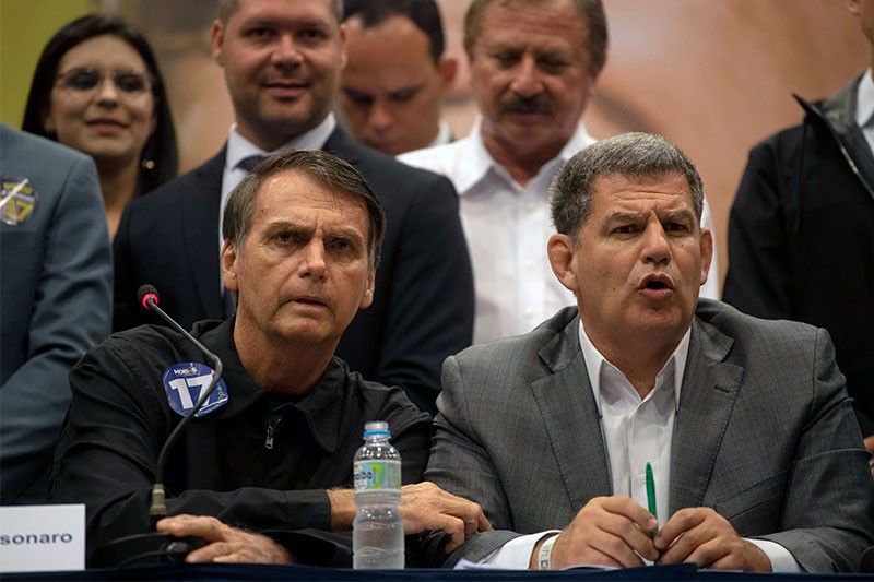 Brazil president sacks close aide amid political scandal