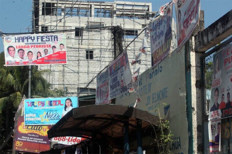 Comelec mulls making candidates pay for removal of illegally placed campaign posters