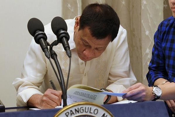 Duterte signs law  on simplified  adoption process