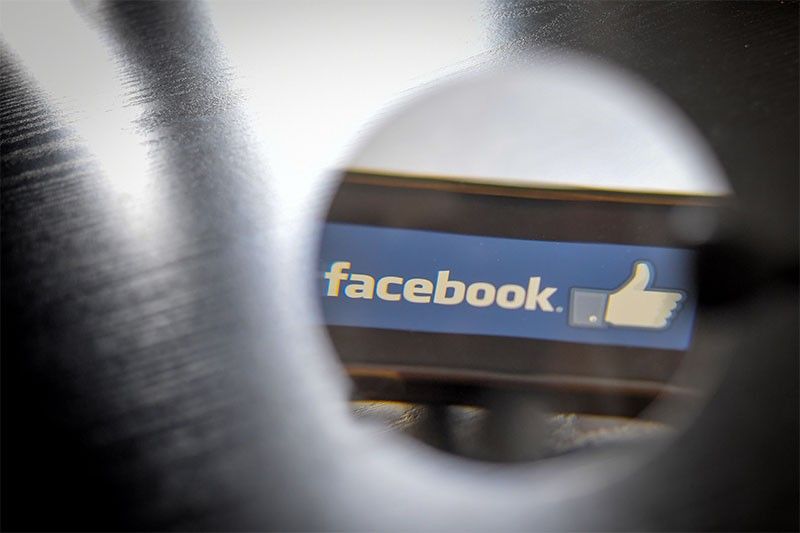 A day not to 'like' for Facebook, hit by outage, criminal probe