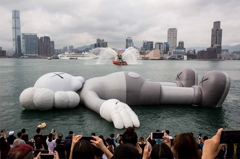Giant KAWS inflatable launches in Hong Kong harbour