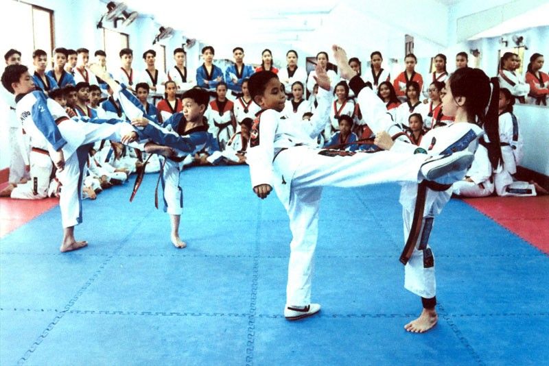 Thousands  bid for â��yellow beltsâ�� in taekwondo summer class
