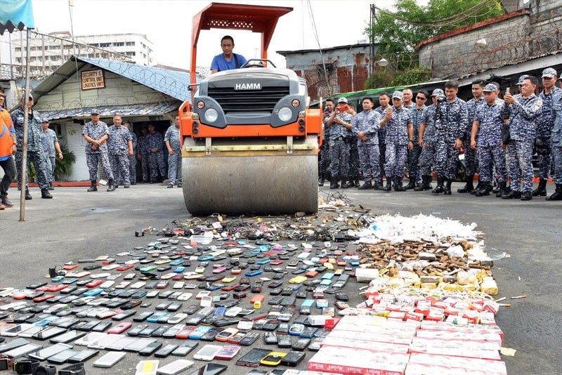 Tobacco bricks, gadgets destroyed in Manila jail search