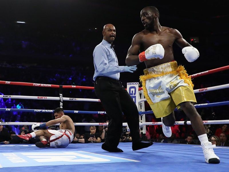 Crawford stops Khan to retain WBO welterweight title