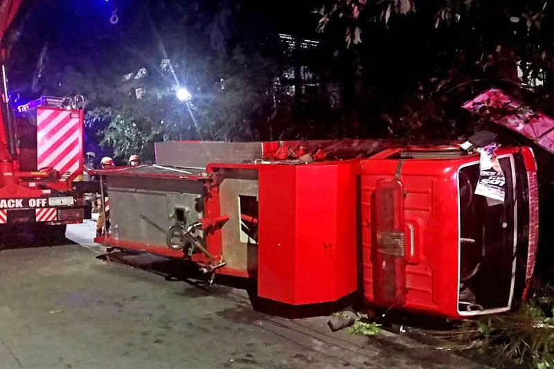 4 hurt as firetruck turns over