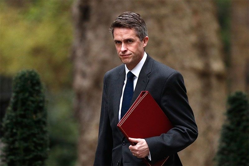 UK's May sacks defence minister Williamson over Huawei leak