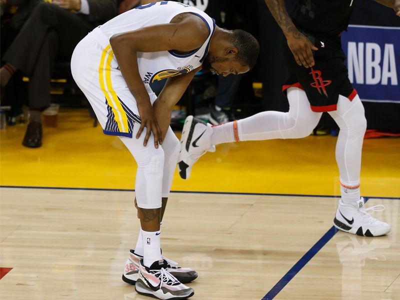 Durant goes down, Warriors hold off Rockets in Game 5