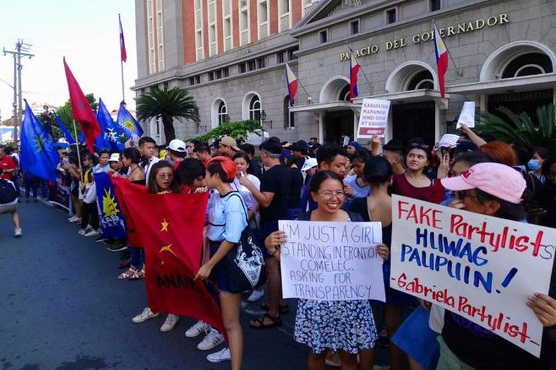 WATCH: Progressive groups protest at Comelec over allegedly rigged elections