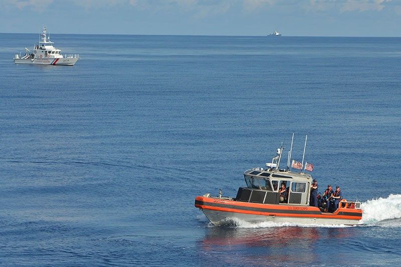 Chinese coast guard ships seen monitoring Philippine, US ships in South China Sea