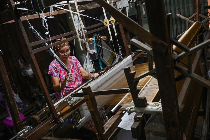 By a thread: Thai Muslim family keeps silk weaving heritage alive