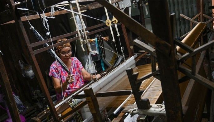 By a thread: Thai Muslim family keeps silk weaving heritage alive