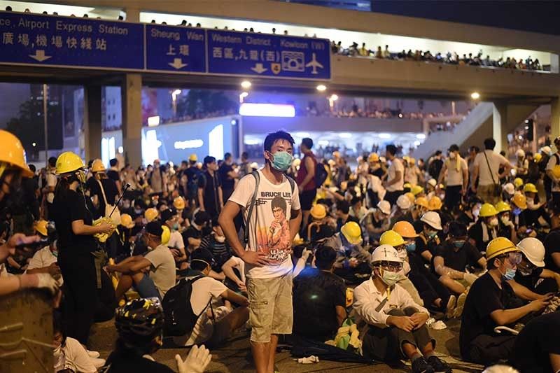 From homework to helmets, Hong Kong's protesters evolve and harden