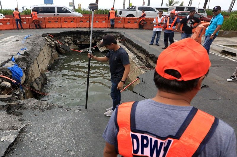 WATCH: Authorities survey collapsed area on Roxas Boulevard