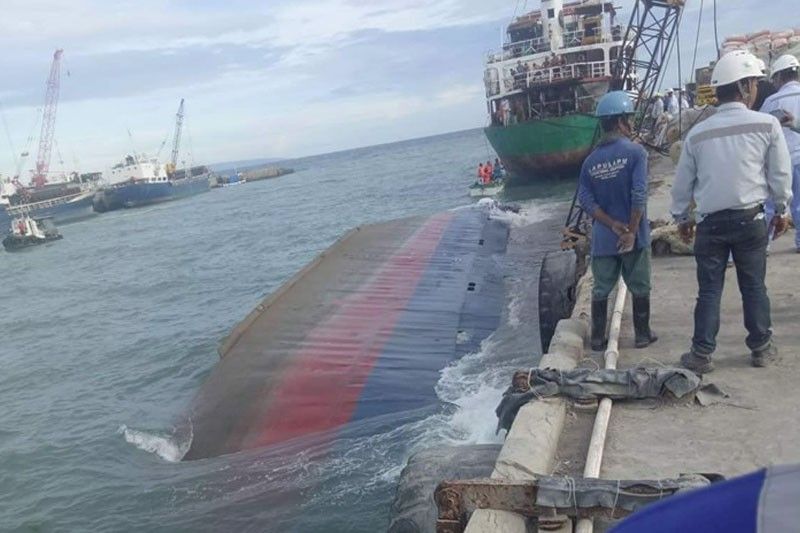 Cargo ship capsizes; oil spill â��possibleâ��
