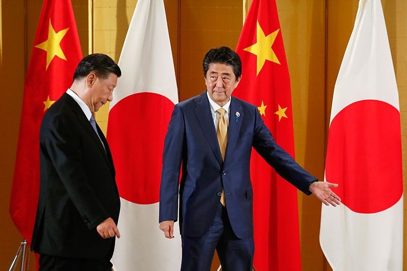 Xi agrees 'in principle' to Japan state visit next year