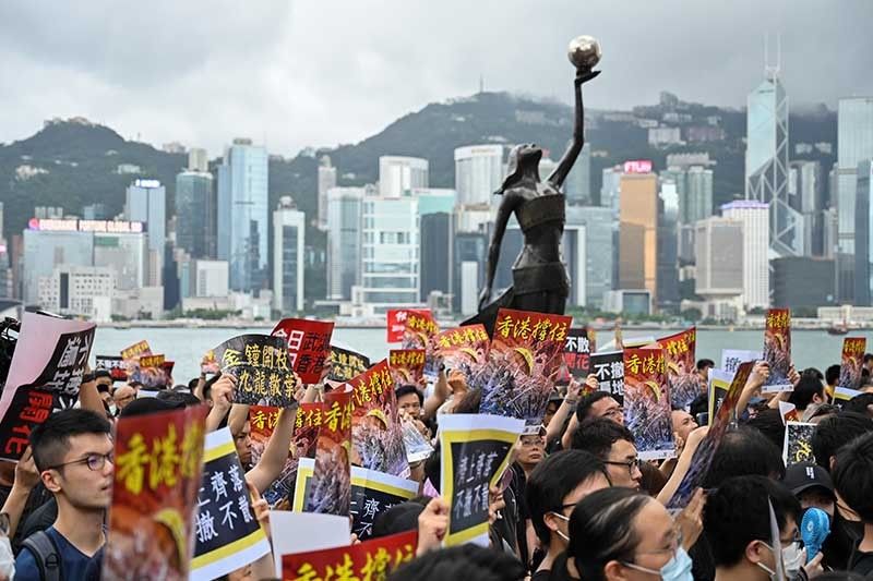 Protesters unmoved as Hong Kong leader says China extradition bill 'dead'