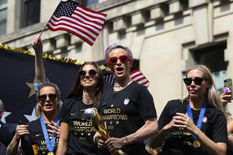 US World Cup winners feted with confetti, chants of 'equal pay'