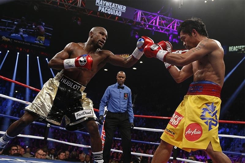 Mayweather shows up at Pacquiao-Thurman bout