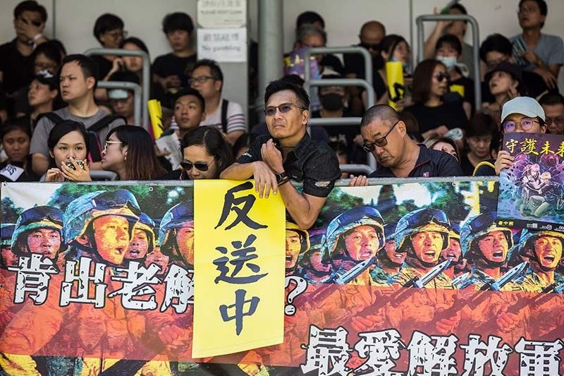 Hong Kong leader says city on brink, protesters cause travel chaos