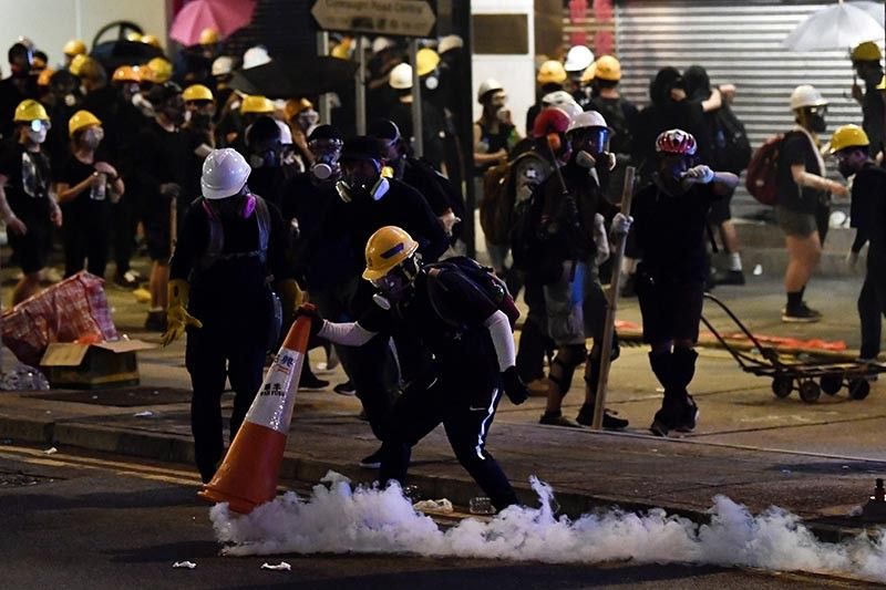 Hong Kongers harness traffic cones, kitchenware to battle tear gas