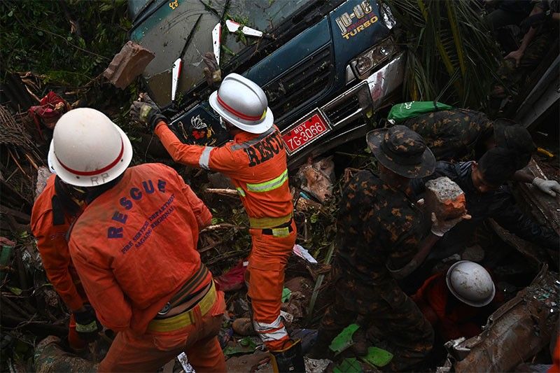 Myanmar troops help flood rescue after landslide kills 51