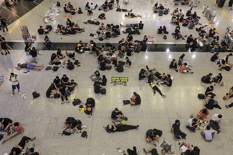 Hong Kong airport protesters retreat, but city in turmoil