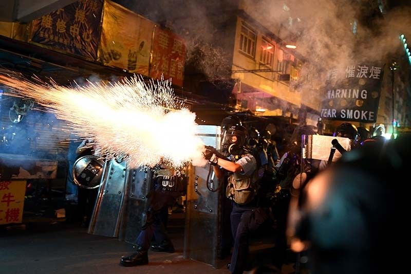 Bruised but unbowed Hong Kong police say no need for China intervention