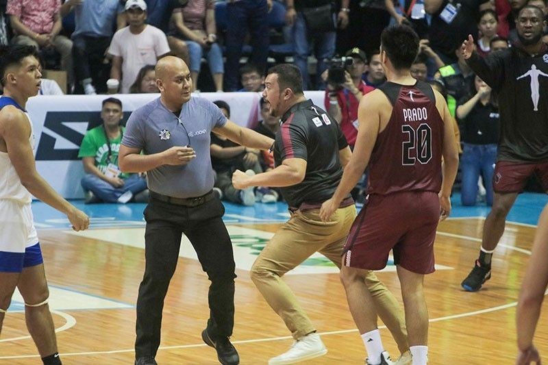 In this Sept. 29, 2019 photo, UP head coach Bo Perasol charges into the court in the third quarter of their game against Ateneo to complain about a non-call.