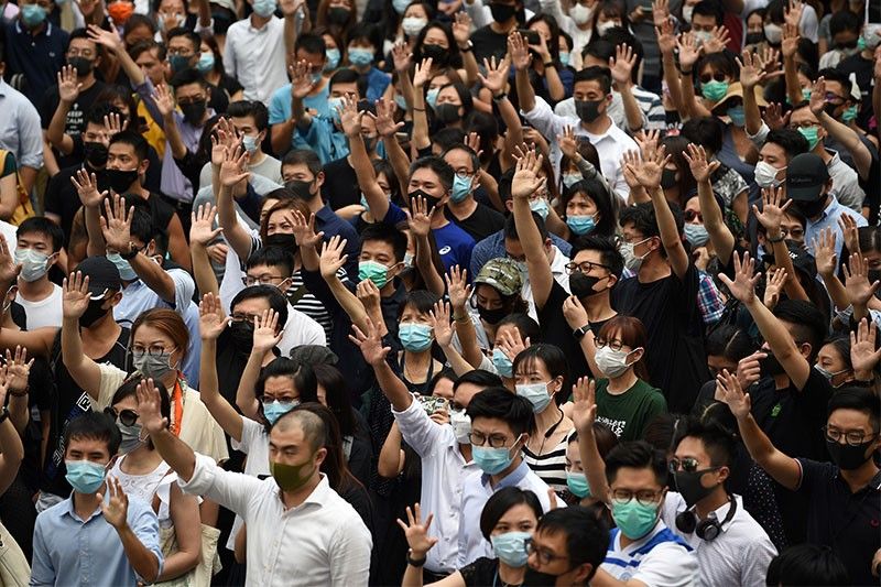 New protests as Hong Kong government mulls face mask ban