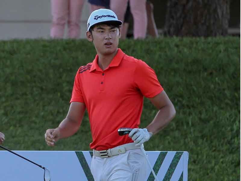Shin sparkles with record 64, leads by 1