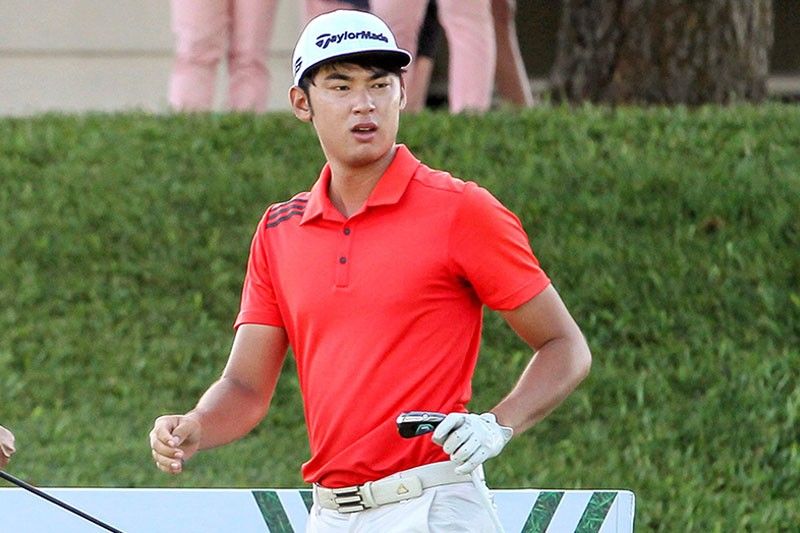 Shin shines with record 64, leads by 1