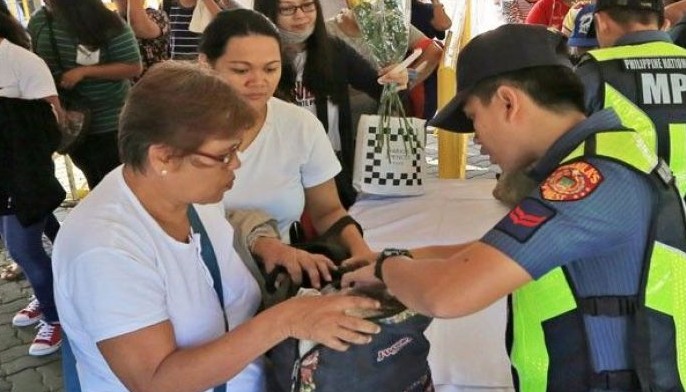 Thousands flock to cemeteries