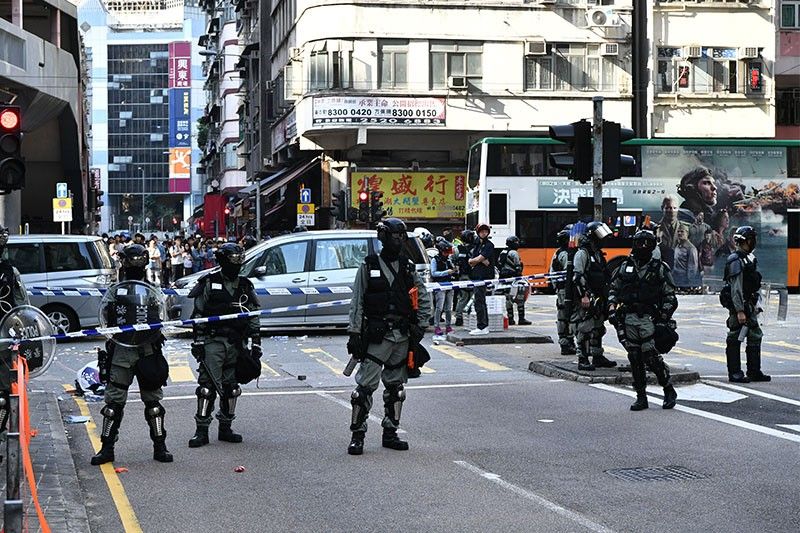 Hong Kong police shoot protester as protests start working week