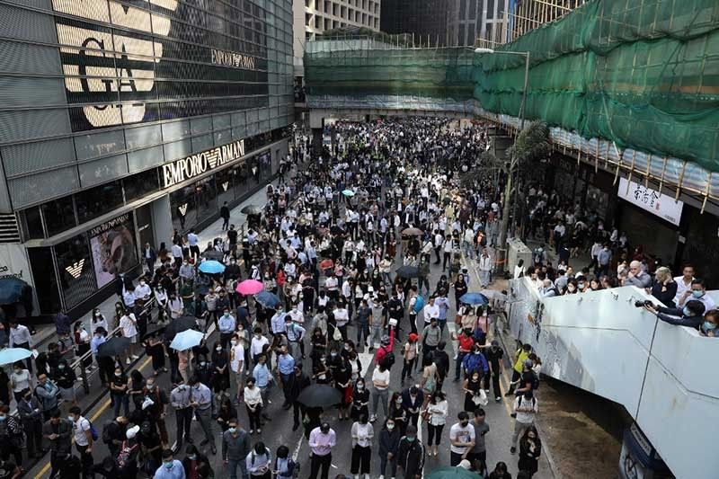 Chaos in Hong Kong as pro-democracy protests 'blossom everywhere'