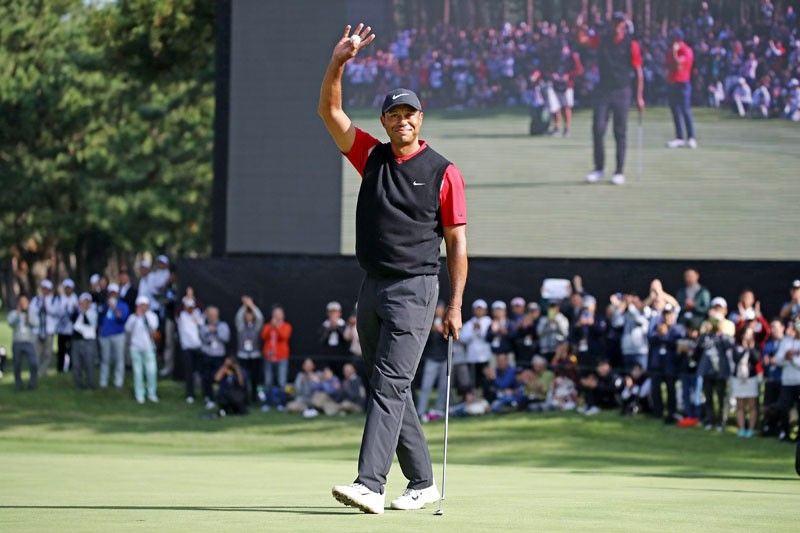 Tiger Woods wins big in Japan