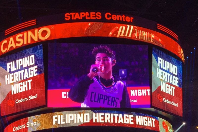 Inigo Pascual performs at NBA game